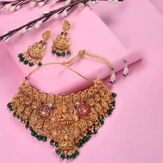 https://retrofashionzs.com/products/gold-plated-kemp-stone-studded-lakshmi-design-with-dangling-green-beads-choker-set